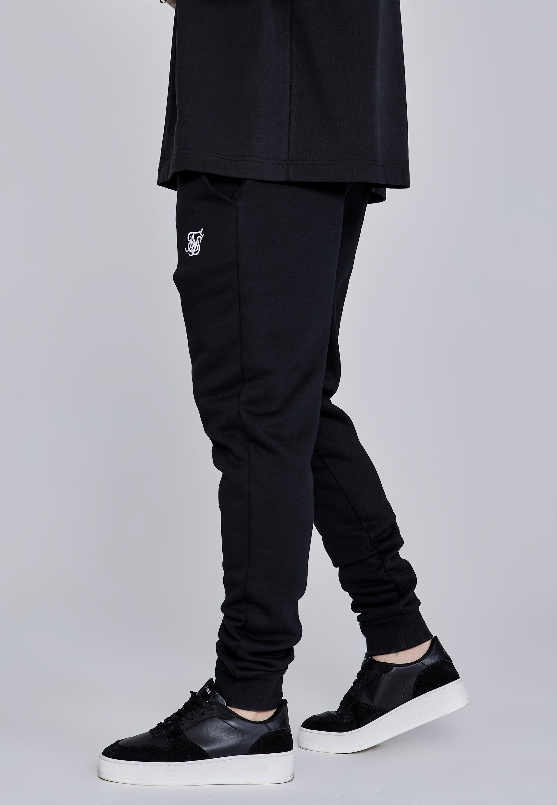 Joggers essenziali in nero Pantaloni SikSilk