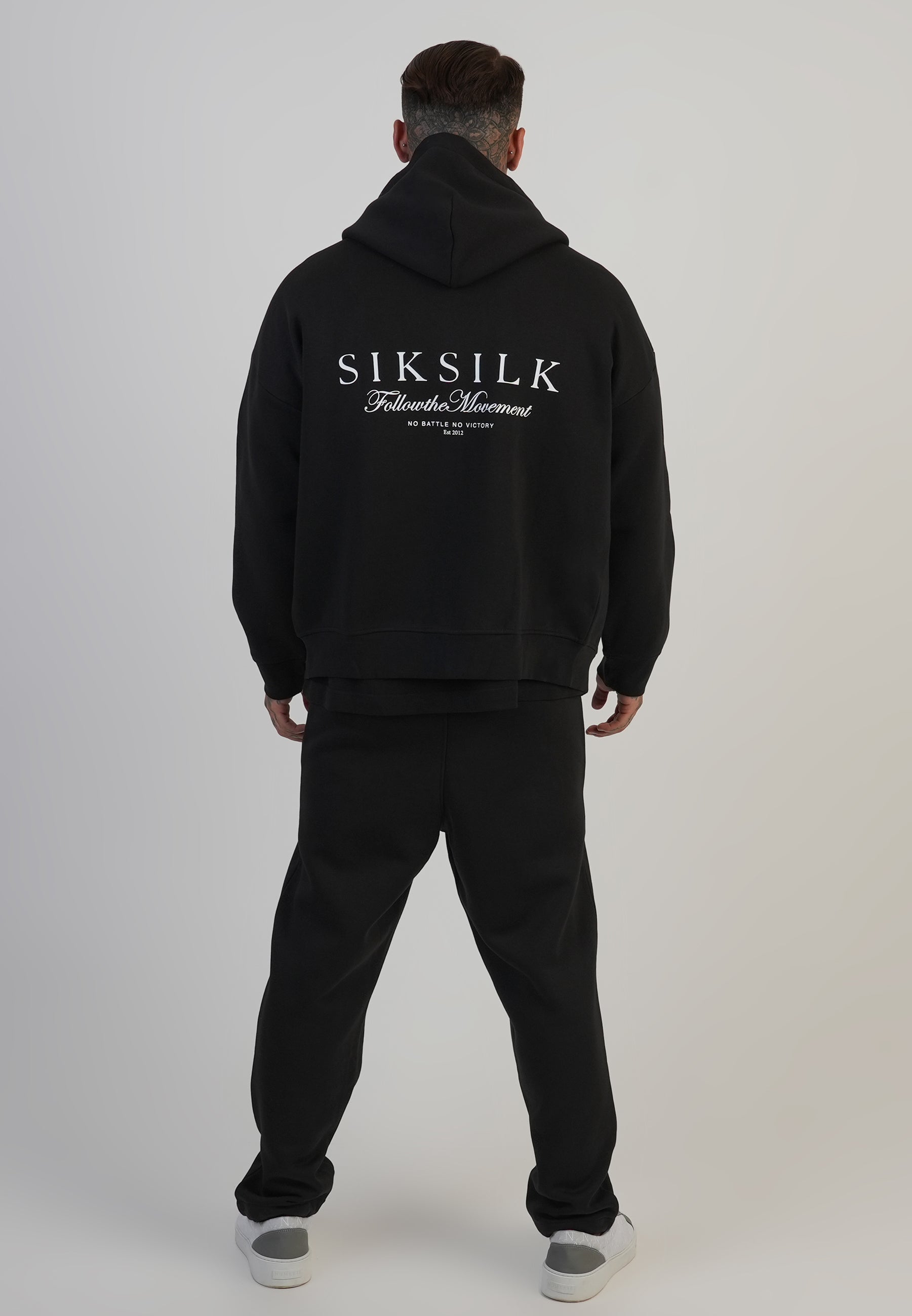 Pantaloni da corsa in nero Pantaloni SikSilk