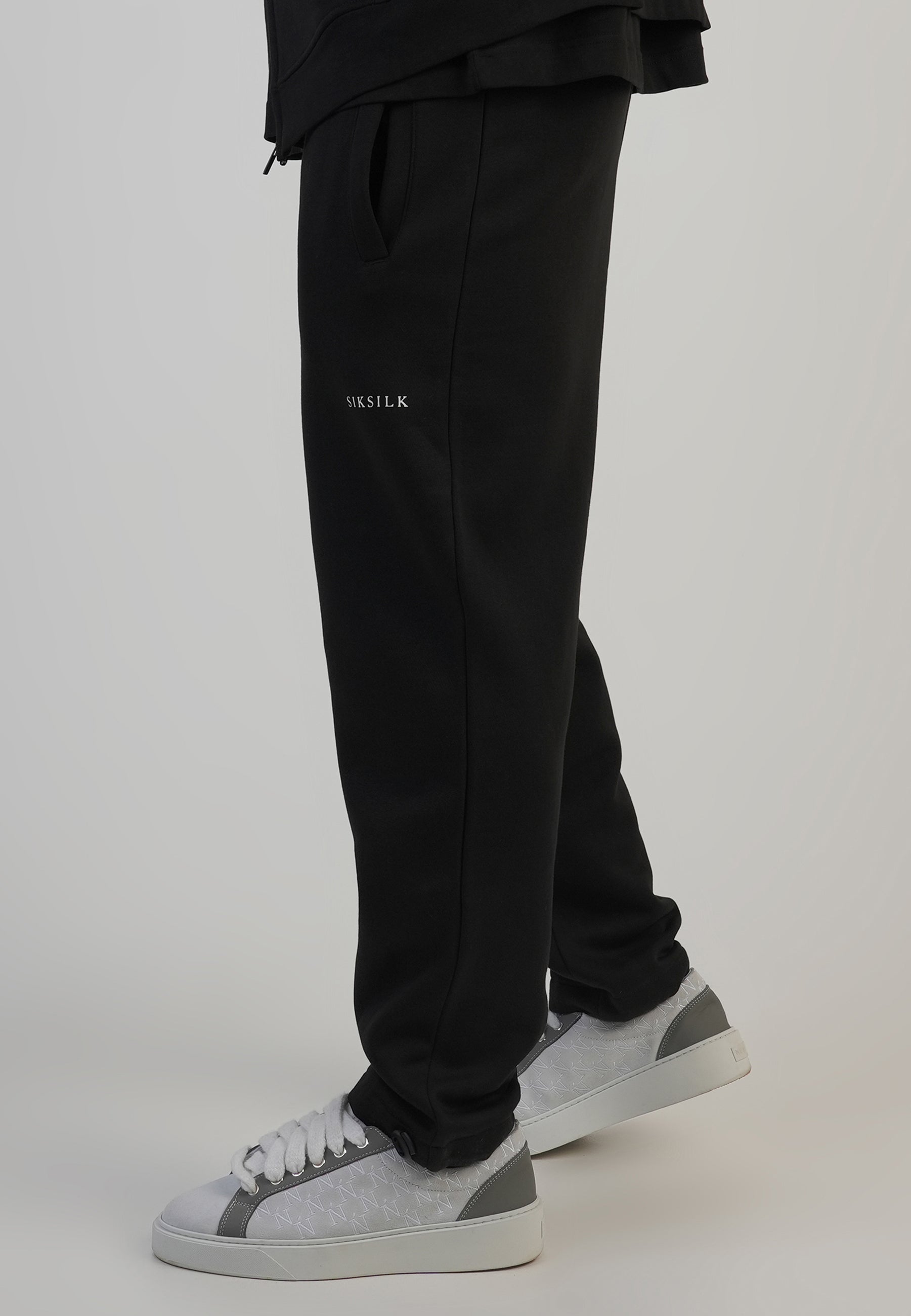 Pantaloni da corsa in nero Pantaloni SikSilk