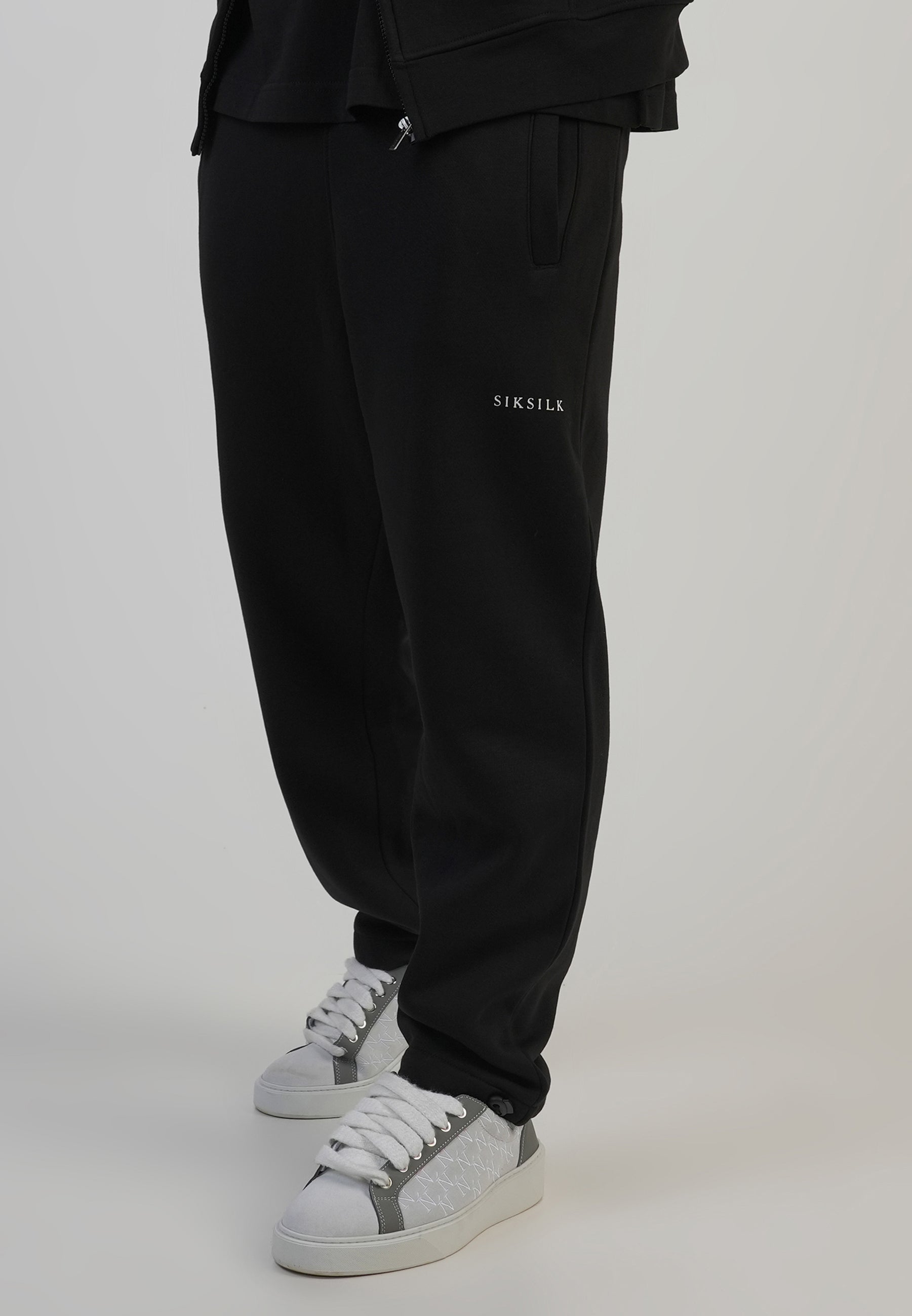 Pantaloni da corsa in nero Pantaloni SikSilk